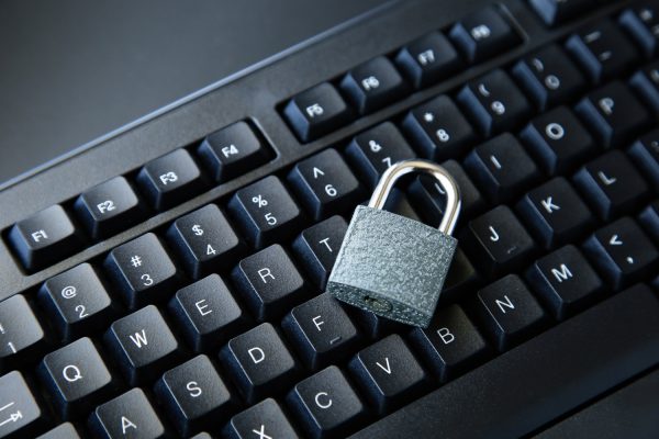 high-angle-shot-lock-black-computer-keyboard-black-surface